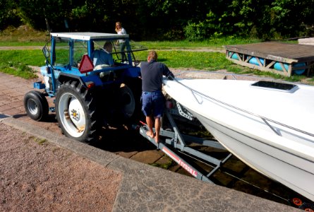 Getting the boat out of the water 5 - Hauling the trailer with the boat up from the boat ramp 2 photo