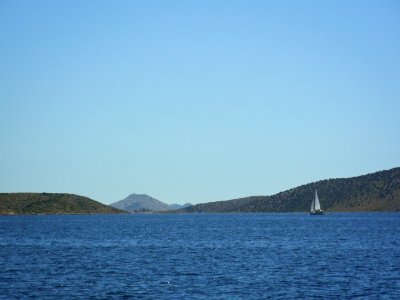 Sailing boat in front of Kornati Islands photo