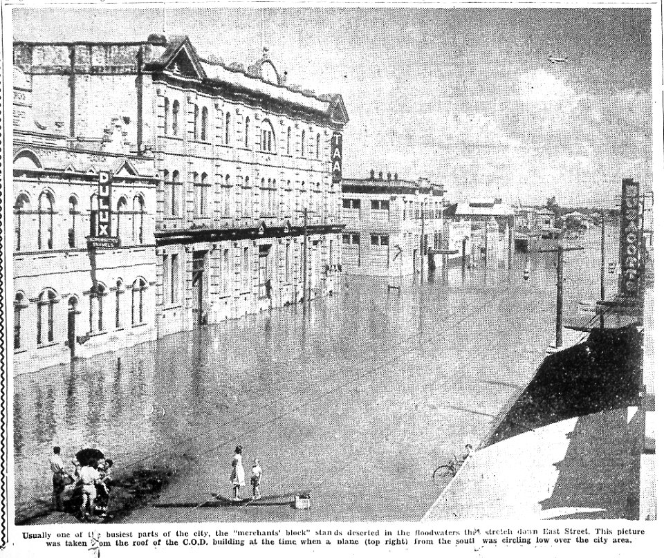 1954, February 19.  East Street, Rockhampton in flood. Cutting from The Morning Bulletin, page 1.