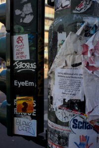 Streetlamp covered in stickers and posters, Torstrasse, Mitte