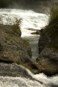 Water Rushing through Rocks at Rhine Falls, Switzerland photo