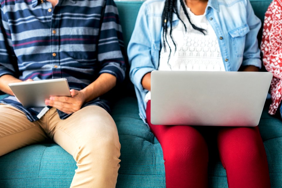 Man and woman using electronic device free image