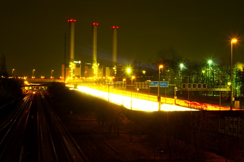 Over-long exposure of power station and motorway, seen from bridge over S Hohenzollerndamm