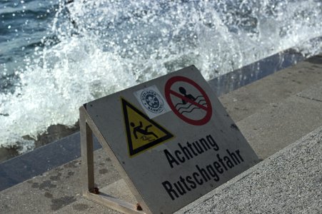 Waves Crashing behind Warning Sign, Bregenz, Austria