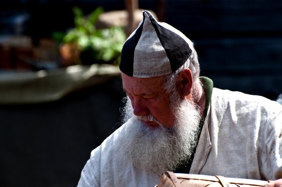 Basket weaver in medieval fair in Leksand