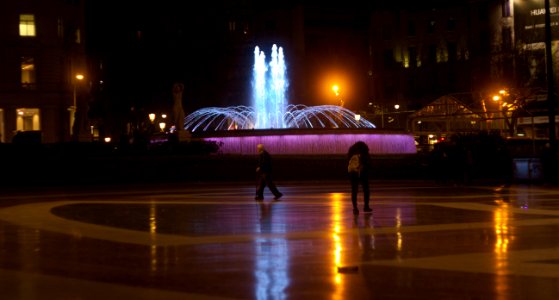 Fountain and People at Night on Plaça de Catalunya photo
