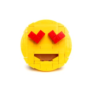 Brick-moji: Smiling face with heart-shaped eyes photo