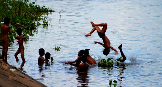 glue sniffing street boys taking a bath tonle sap river, riverside park, Phnom Penh