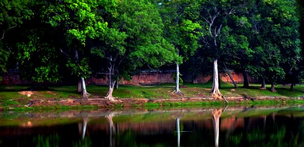 The moat and fortification surrounding Angkor wat Temple photo