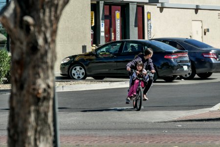 parking lot girl on handlebars