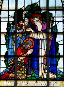 St. Patrick baptising St. Maughold - Stained glass window at Jurby, Isle of Man photo