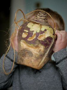 Moot face: A Hop tu Naa turnip held by a child photo