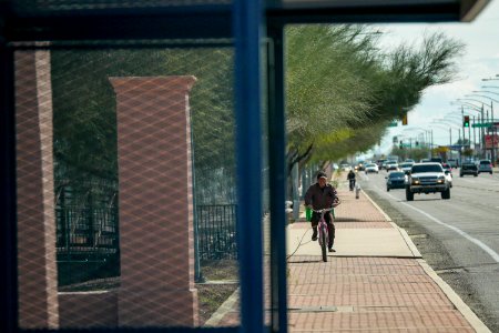 two bikers on sidewalk