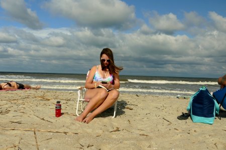 CLOSE KATIE ON PHN ON BEACH-P1790745 photo