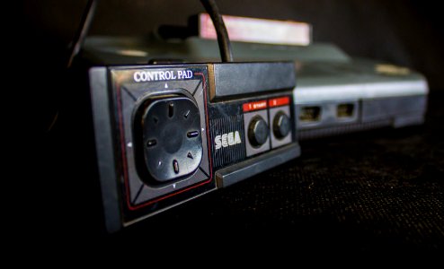 Sega Master System II with focus on controller photo