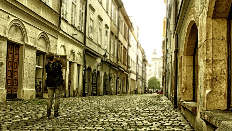 Magic of the old city. Prague street and young photographer