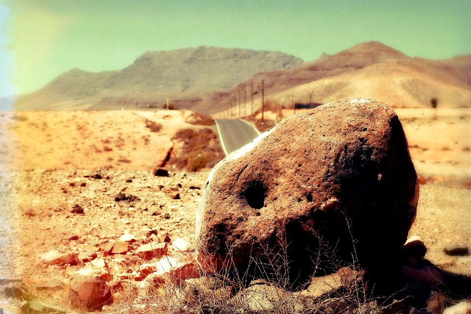 Fuerteventura - red stone in the desert at hot sun