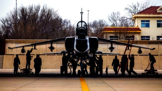 JH-7 Fighter Bomber Being Serviced