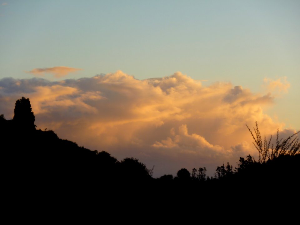 sunset clouds over hills