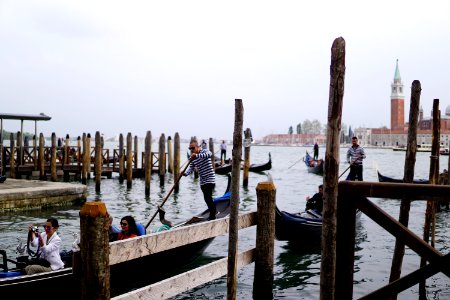 Gondoleros and tourists photo