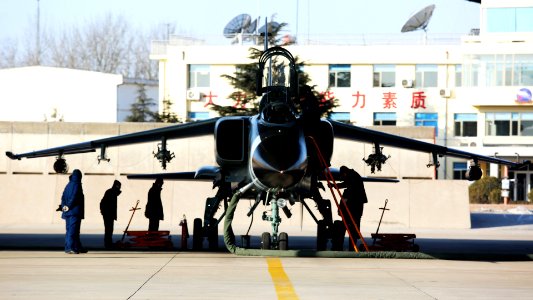 JH-7 Fighter Bomber Being Serviced