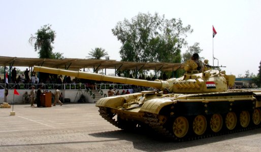 An Iraqi T-72 tank passes in review during a ceremony marking the 2nd Iraqi Brigade's assumption of responsibility at Camp Taji