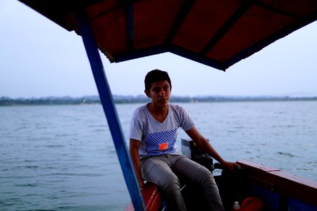 Young boatman in Peten Itza photo