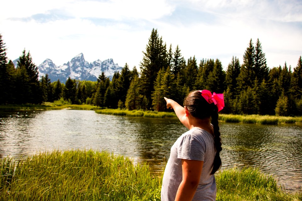 Visitor pointing towards the mountains