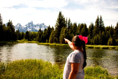 Visitor pointing towards the mountains