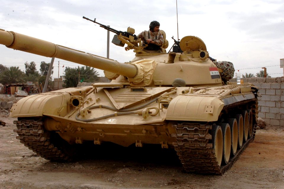 Iraqi Soldiers from 1st Battalion, 71 Cavalry Regiment stand guard on the streets of Baghdad, Iraq February 27, 2006