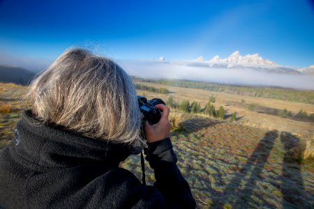 Visitor taking pictures of cloud bans
