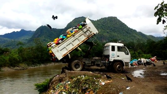 Dump Truck Dumping Toxic Medical Waste in river, Peru