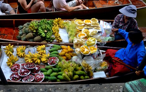 Vendors in floating market, Thailand photo