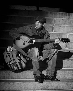Street musician sitting person photo
