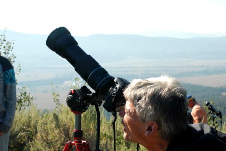 Visitor photographing eclipse from Signal Mountain Summit