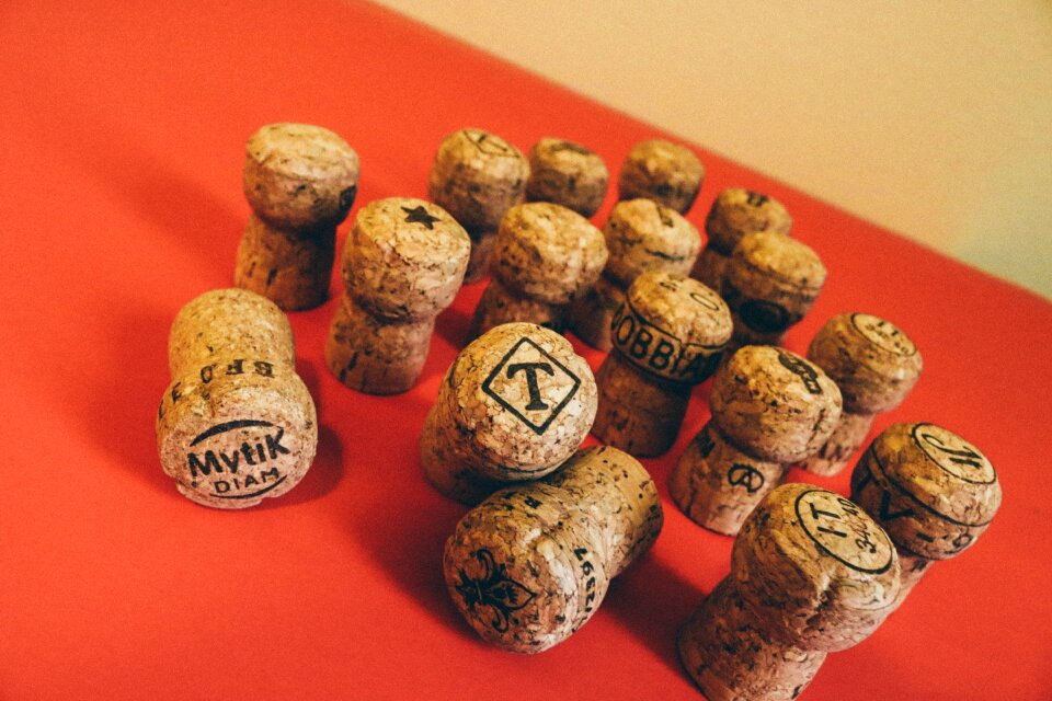 Corks in a vase drink red