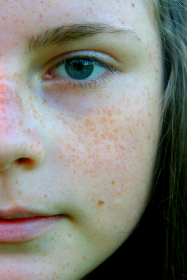 Freckle face portrait blue eyes