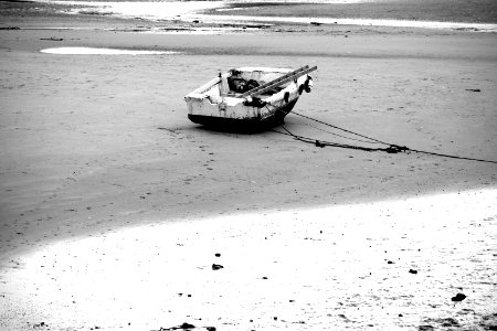 A boat at Folkestone harbour at low tide photo