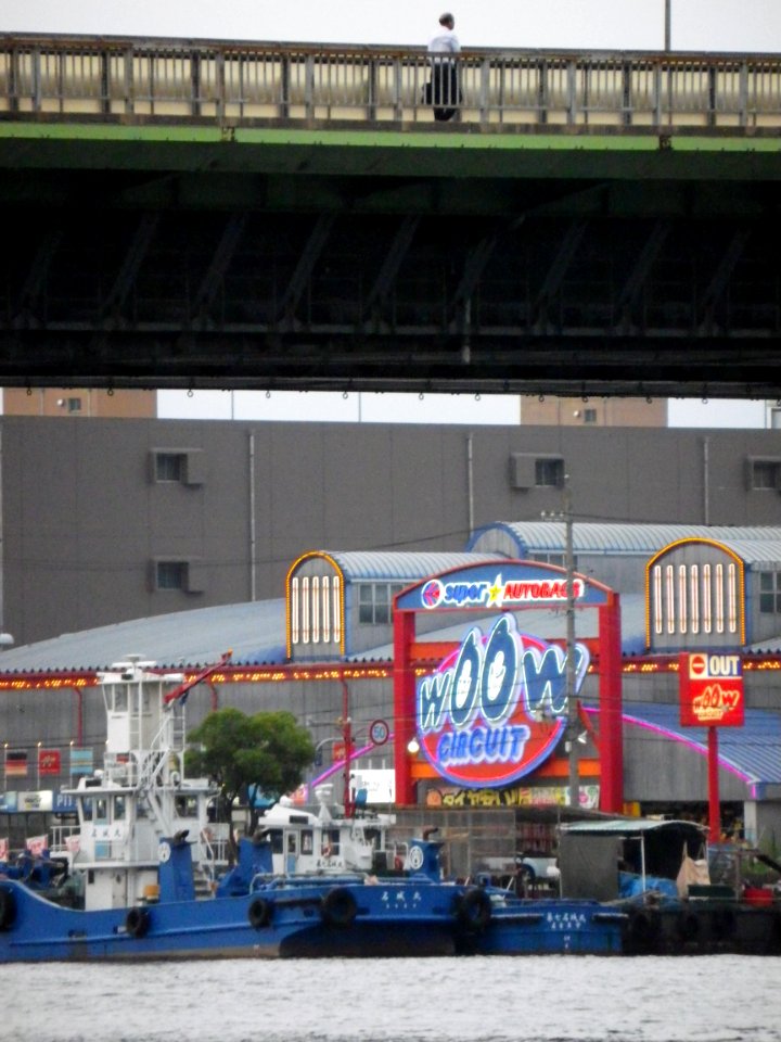 wOOw CIRCUIT neon sign and 2 blue boats