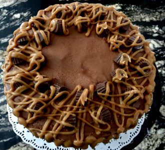 Chocolate cake with peanut butter filling and Reese's pieces photo