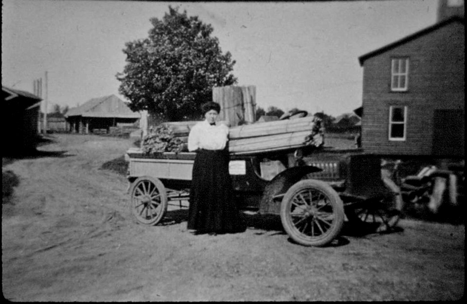 Old Hicksville . Mrs. Louise Augustin,   1856-1942, ..Augustin Lumber yard truck behind the Augustin Home.