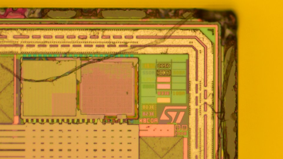 SIM card chip 1 - top metal - die markings (ST ST33F) photo