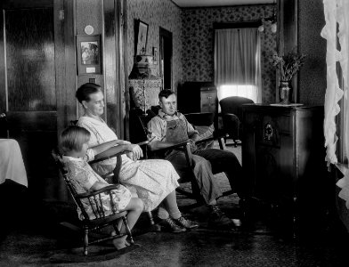 A farm family listening to their radio