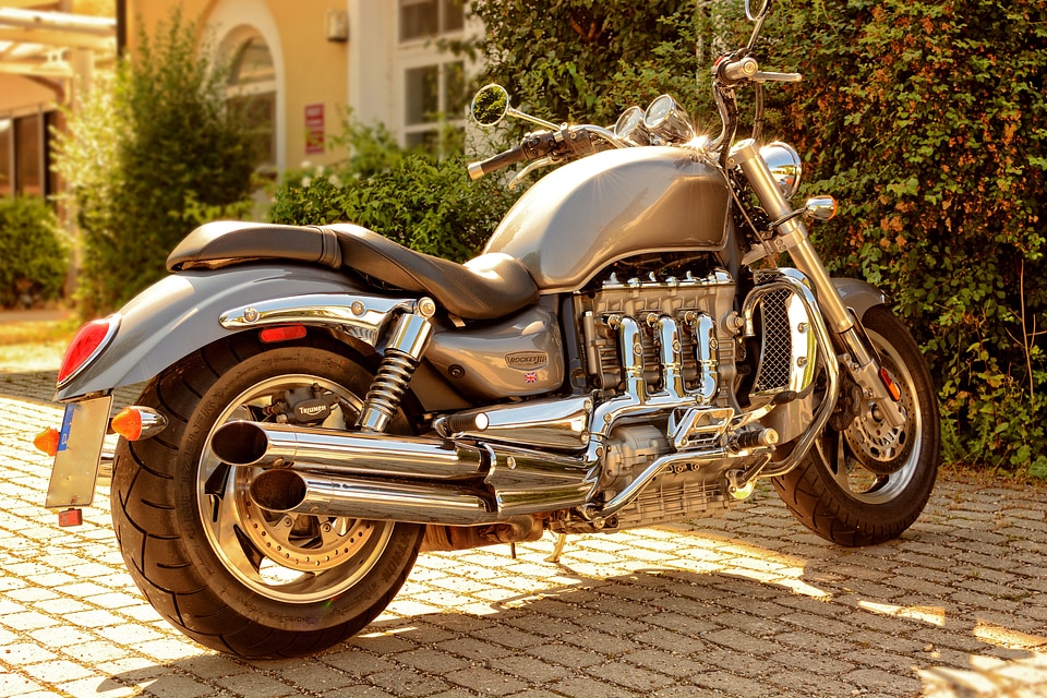 Two wheeled vehicle cylinder exhaust system