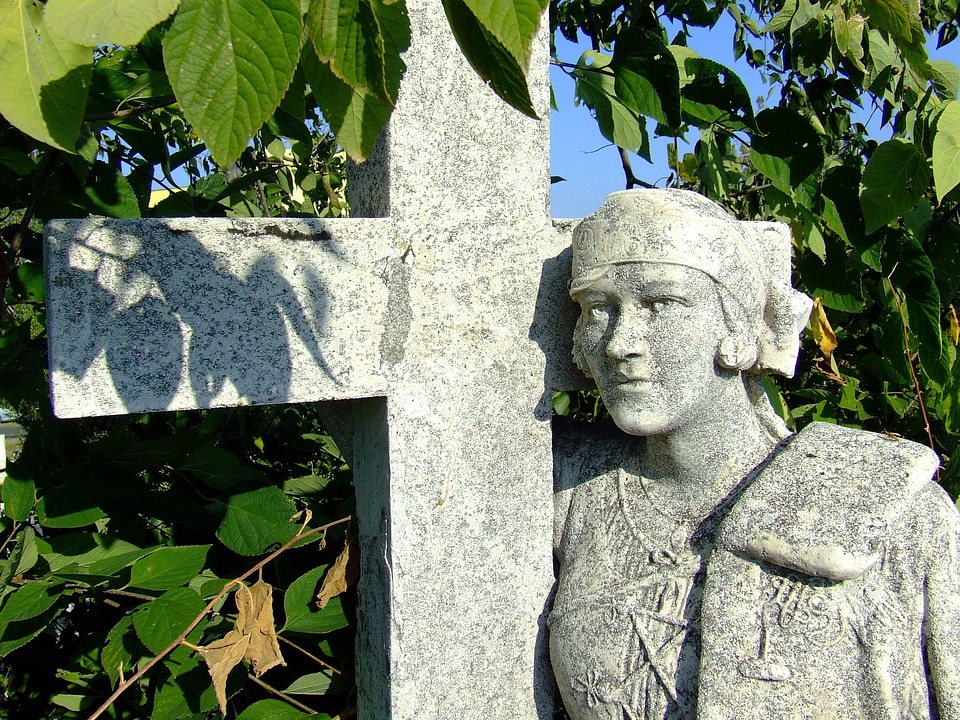 Statue cross person