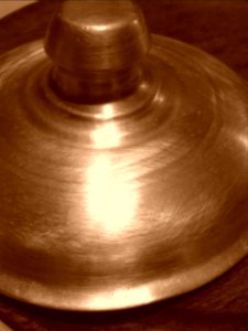 Tapa de bronce