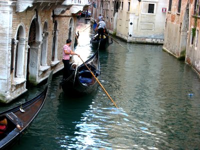 Venice canal with gondolas photo