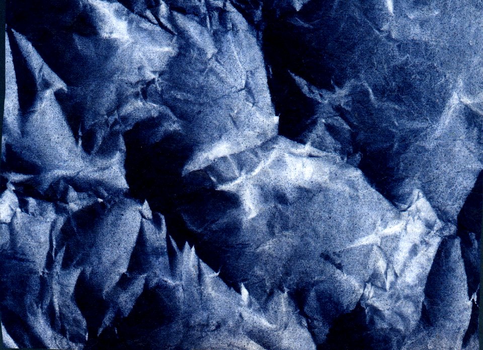 crumpled blue paper photo
