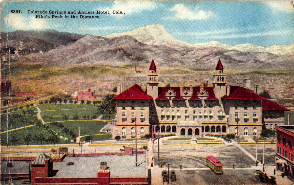 8391. COLORADO SPRINGS AND ANTLERS HOTEL COLORADO PIKES PEAK IN THE DISTANCE