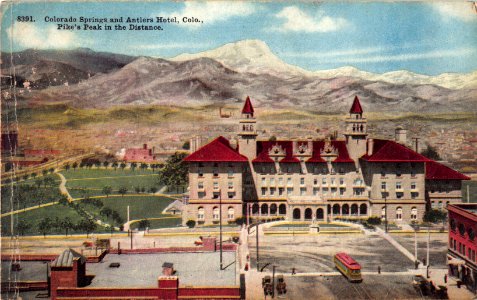 8391. COLORADO SPRINGS AND ANTLERS HOTEL COLORADO PIKES PEAK IN THE DISTANCE